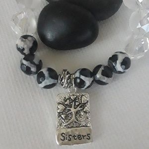 Handcrafted "Sisters" black white charm bracelet